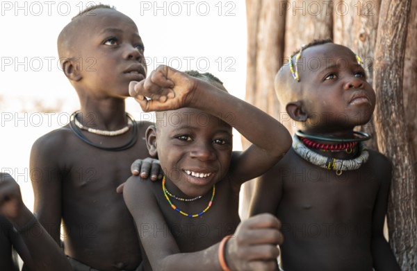 Portrait, curious Himba kids, traditional Himba village, Kaokoveld, Kunene, Namibia