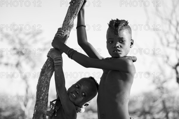 Black and white, portrait, two Himba children, traditional Himba village, Kaokoveld, Kunene, Namibia