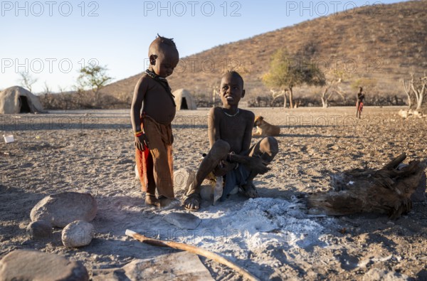 Himba children at a fireplace, traditional Himba village, Kaokoveld, Kunene, Namibia