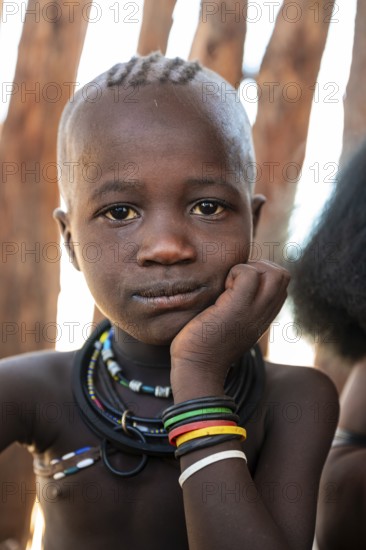 Portrait, curious Himba child, traditional Himba village, Kaokoveld, Kunene, Namibia