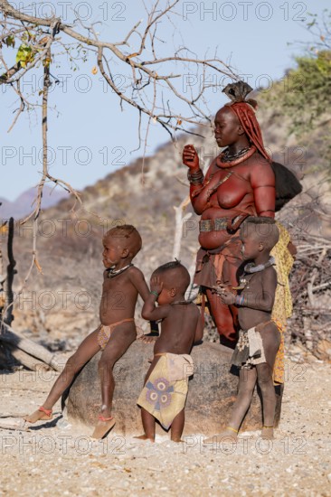 Himba woman and children, traditional Himba village, Kaokoveld, Kunene, Namibia