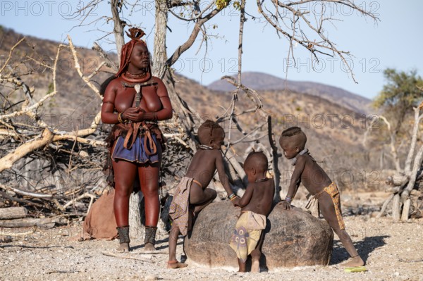 Himba woman and children, traditional Himba village, Kaokoveld, Kunene, Namibia
