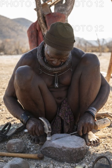 Elderly man, Himba blacksmith, traditional Himba village, Kaokoveld, Kunene, Namibia