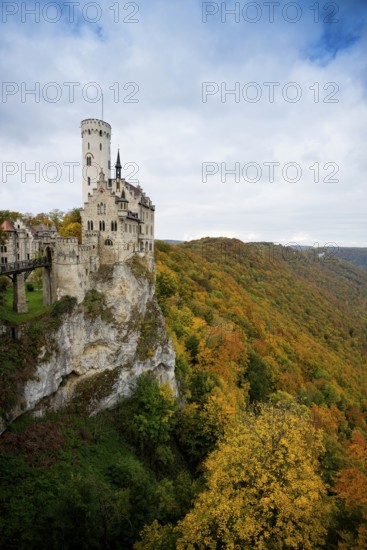 Castle and autumnal forest, Lichtenstein Castle, Honau, Echaz Valley, Swabian Jura, Baden-Württemberg, Germany