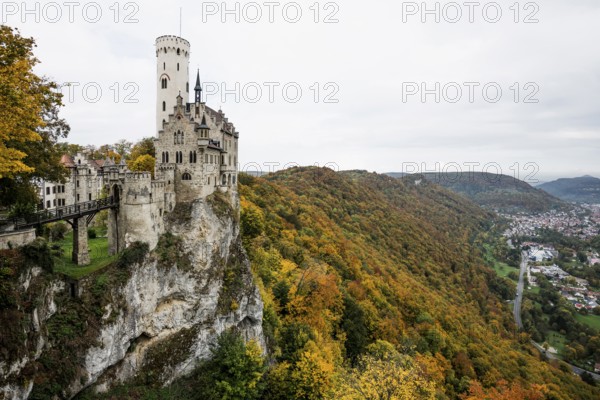 Castle and autumnal forest, Lichtenstein Castle, Honau, Echaz Valley, Swabian Jura, Baden-Württemberg, Germany