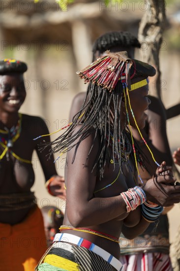 Traditional dance, brightly decorated woman of the Hakaona tribe, also Havakona or Hakawona, near Opuwo, Kunene, Namibia