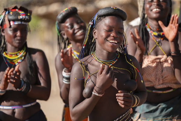 Traditional dance, brightly decorated woman of the Hakaona tribe, also Havakona or Hakawona, near Opuwo, Kunene, Namibia