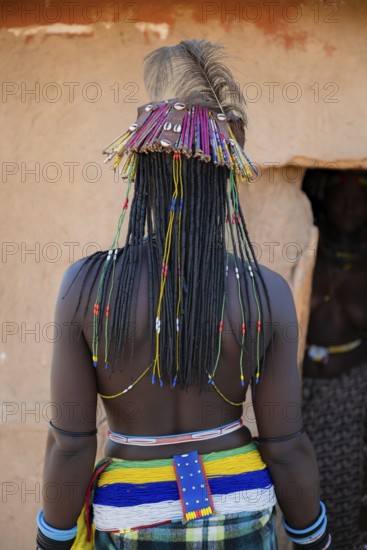 Detail hair decoration, brightly decorated woman of the Hakaona tribe, also Havakona or Hakawona, near Opuwo, Kunene, Namibia