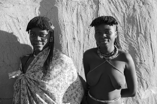 Black and white, portrait, brightly decorated woman of the Hakaona tribe, also Havakona or Hakawona, near Opuwo, Kunene, Namibia