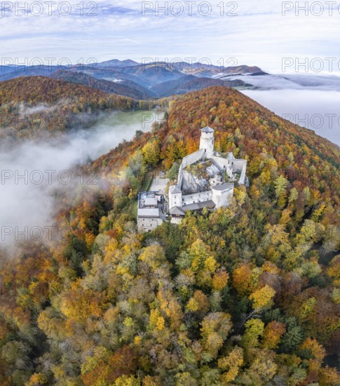 Aerial view of Araburg with autumn forest and fog, Kaumberg, Lower Austria, Austria