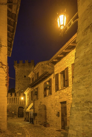 Narrow alley at night, Borgo di Vigoleno, Vernasca, Piacenza Province, Italy