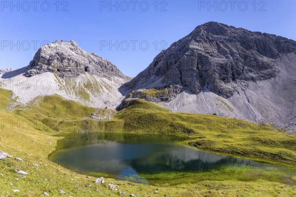 The Rappensee (also Großer Rappensee), a Bavarian high mountain lake at 2047m, behind it Hochgundspitze, 2459m, and Rappenseekopf, 2468m, Allgäu Alps, Allgäu, Bavaria, Germany