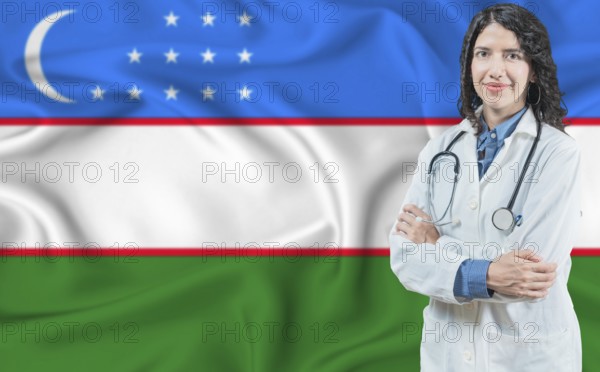Uzbek medicine and healthcare concept. Doctor close up against Uzbekistan flag background