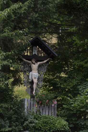 Traditional waycross with figure of Christ, mountaineering village Zgornje Jezersko, Slovenia