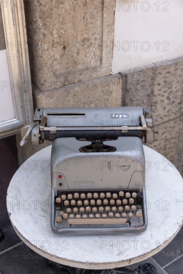 Historic typewriter on a small table, old town of Ljubljana, Slovenia