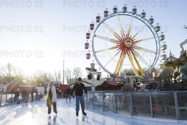 Skaters in front of the Ferris wheel at the Berlin Christmas market on Alexanderplatz, Berlin, 15.12.2025