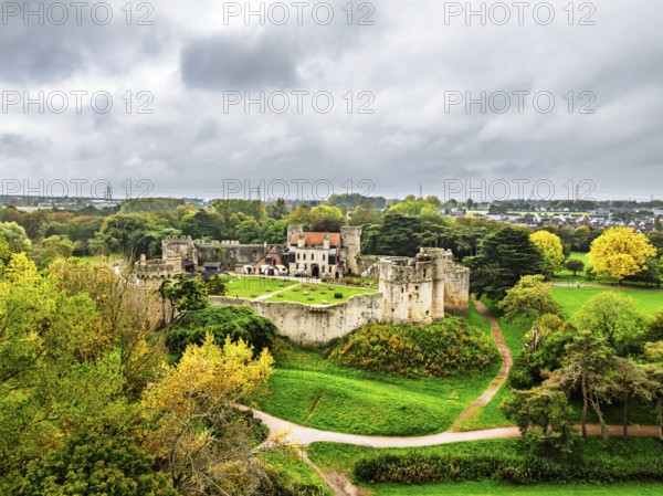 Autumn Colours over ruins of Caldicot Castle from a drone, Caldicot, Monmouthshire, Wales, UK
