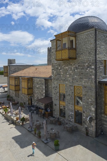 Stone building with decorative wood paneling and dome surrounded by blue sky, Rabati Fortress, Akhaltsikhe, Samtskhe-Javakheti region, Samtskhe-Javakheti, Georgia