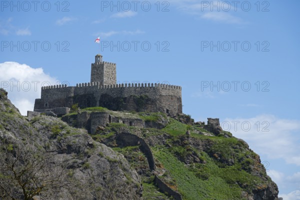 Medieval castle on a steep hill with stone walls and a watchtower under a blue sky, Rabati Fortress, Akhaltsikhe, Samtskhe-Javakheti region, Samtskhe-Javakheti, Georgia