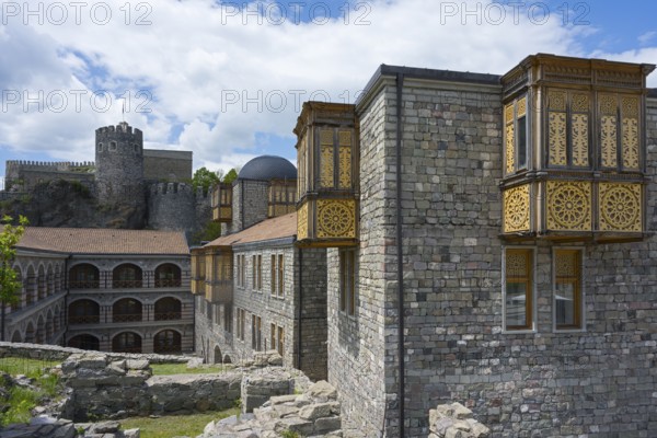Historic buildings with towers and detailed wooden elements under a blue sky, Rabati Fortress, Akhaltsikhe, Samtskhe-Javakheti region, Samtskhe-Javakheti, Georgia