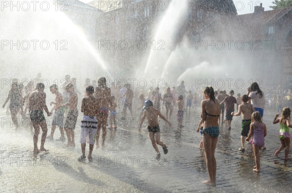 A popular event every year in August is when the Ystad Volunteer Fire Brigade takes the old fire pump made in 1850 to the square and sprays water on the assembled children, who are then baptized as true Ystad residents. Ystad, Skåne County, Sweden, Scandinavia