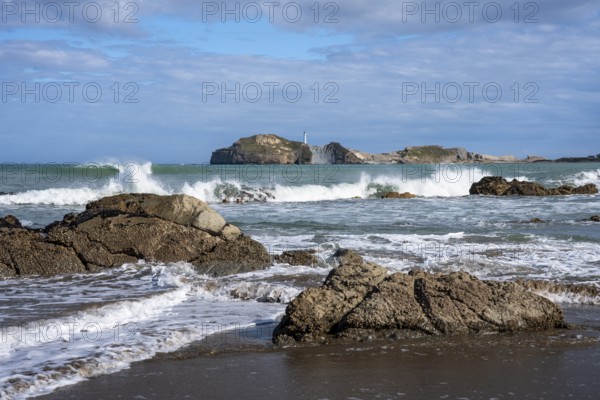 Castlepoint Beach and Castlepoint Lighthouse, ocean, waves, surf, sandy beach, rocks. Castlepoint, Wairarapa Coast, Wellington Region, North Island, New Zealand