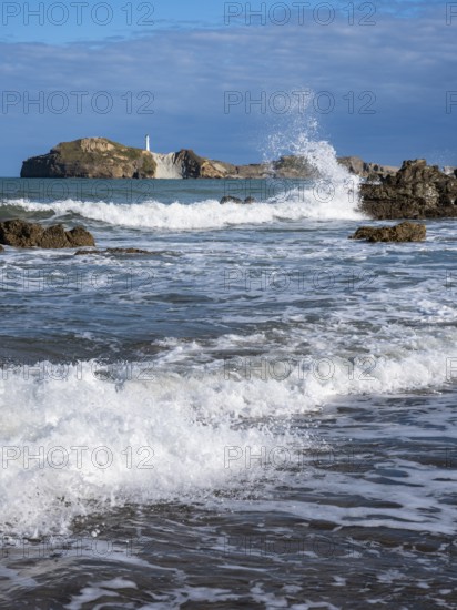 Castlepoint Beach and Castlepoint Lighthouse, ocean, waves, surf, sandy beach, rocks. Castlepoint, Wairarapa Coast, Wellington Region, North Island, New Zealand