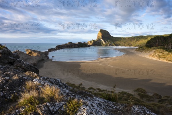 Deliverance Cove and Castle Rock, rocks, ocean, surf, morning. Castlepoint, Wairarapa Coast, Wellington Region, North Island, New Zealand