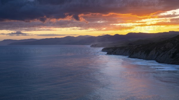 Wairarapa coast at sunset. sea, mountains. Castlepoint, Wairarapa Coast, Wellington Region, North Island, New Zealand