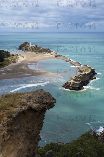 Deliverance Cove and Castlepoint Lighthouse, Castle Rock views, rocks, ocean. Castlepoint, Wairarapa Coast, Wellington Region, North Island, New Zealand