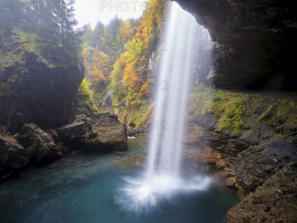 Waterfall mountain list in autumn-colored surroundings, Linthal, Klausenpass, Canton of Glarus, Switzerland
