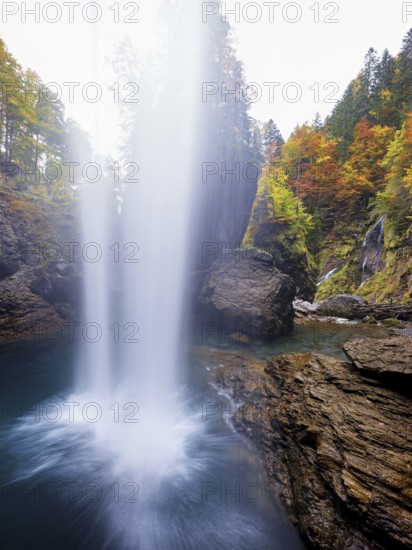Waterfall mountain list in autumn-colored surroundings, Linthal, Klausenpass, Canton of Glarus, Switzerland