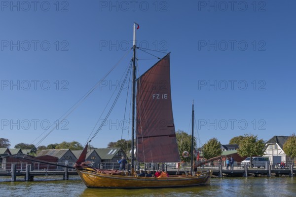 Zeesboot, former historic fishing boat in the port of Ahrenshoop, blue sky, Darß, Mecklenburg-Western Pomerania, Germany