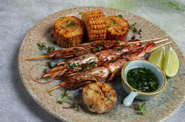 Langoustines on skewers, shrimp kebab, with fried corn, spices and herbs, homemade, no people