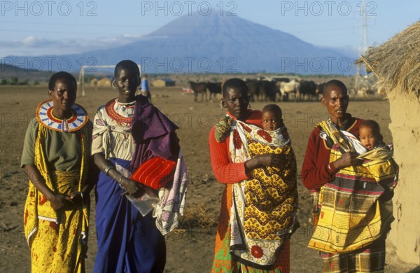 Women with babies pose for the camera in front of Mount Meru near Arusha, Tanzania, Africa, June 2000, vintage, retro, old, historic