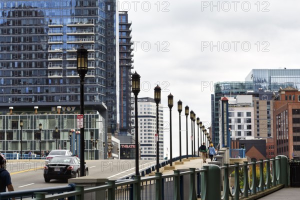 Street lights on Congress Street Bridge, passers-by on pedestrian walkway, office towers, Financial District, Downtown, Boston, Massachusetts, New England, USA