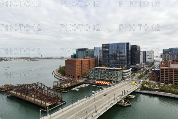View of Northern Avenue Bridge over Fort Point Channel, steel swing bridge, Seaport District, skyline, modern architecture, office towers, residential buildings, cultural offerings, Downtown, Boston, Massachusetts, New England, USA