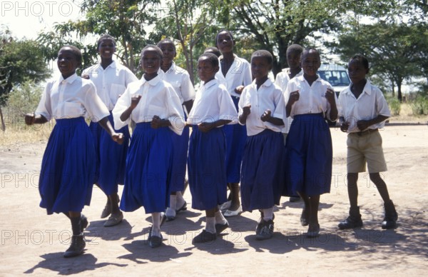 Children from a World Vision project dance on the occasion of a godfather's visit, Nyabubinza, Tanzania, Africa, June 2000, vintage, retro, old, historical