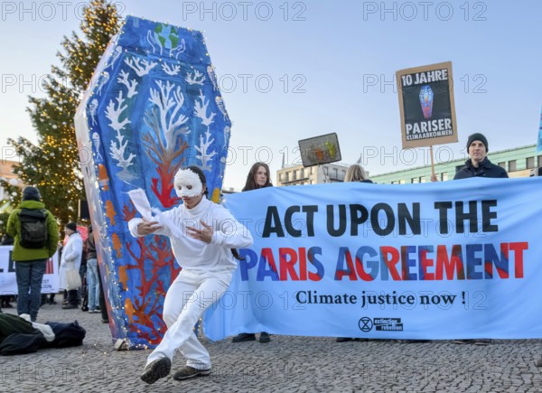 Dancers from Extinction Rebellion dance at Fridays for Future rally to mark the tenth anniversary of the Paris Agreement. Pariser Platz, Berlin, 12.12.2025