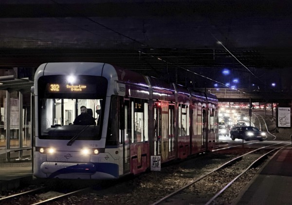 Bogestra tram line 302 at Ernst-Kuzorra-Platz der Kurt-Schumacher-Straße in the evening, Gelsenkirchen, North Rhine-Westphalia, Germany