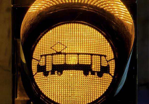 Yellow traffic light with tram symbol in the evening, Gelsenkirchen, North Rhine-Westphalia, Germany