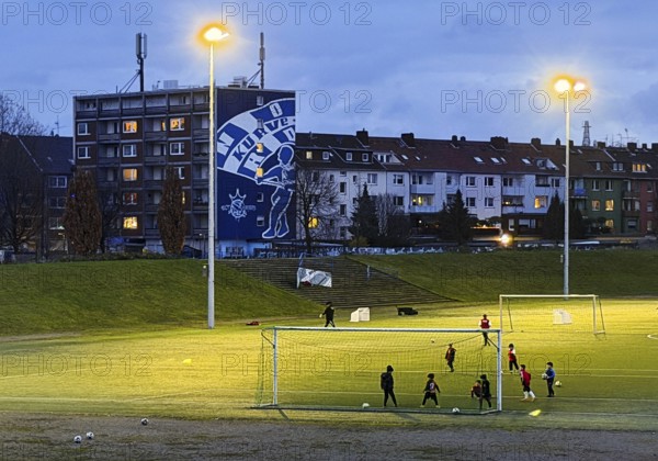 Youth training in the Glückauf Kampfbahn of FC Schalke 04 with wall painting Nordkurve, Gelsenkirchen, Ruhr area, North Rhine-Westphalia, Germany