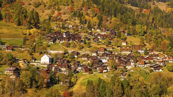 The mountain village of St-Jean in autumn colors, Val d'Anniviers, Valais Alps, Canton of Valais, Switzerland
