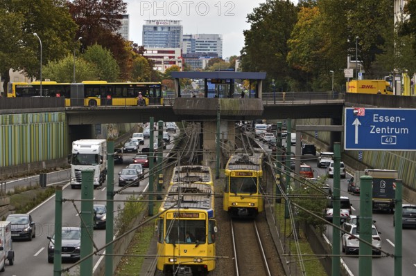 Lots of traffic on the A 40 motorway on four lanes and two subways on two lanes and a bus on the bridge, infrastructure, Essen, Ruhr area, North Rhine-Westphalia, Germany
