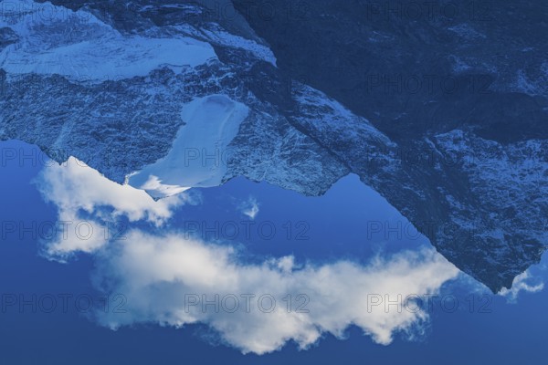 Mountain peaks are reflected in Lac de Chateaupre, Val d'Anniviers, Valais Alps, Canton of Valais, Switzerland