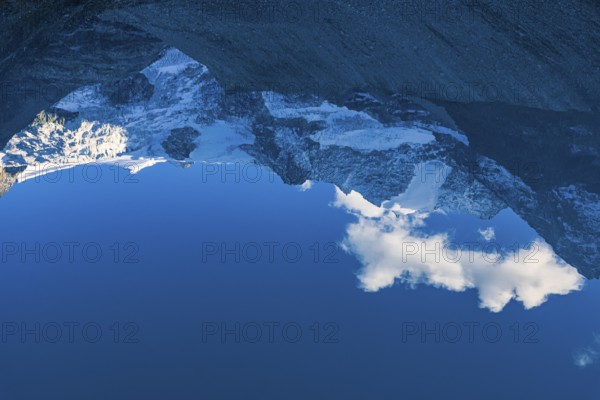 The Moiry glacier and mountain peaks are reflected in Lac de Chateaupre, Val d'Anniviers, Valais Alps, Canton of Valais, Switzerland