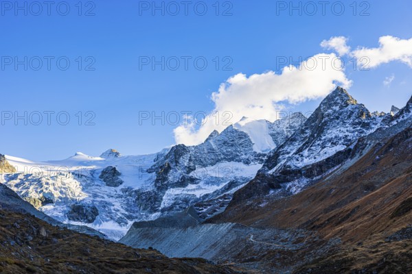 Clouds over the peaks of the Grand Cornier, Tete Blanche and Pointe Moiry mountains, Val d'Anniviers, Valais Alps, Canton of Valais, Switzerland