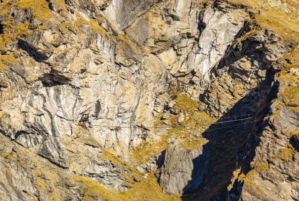 Suspension bridge on a via ferrata near the Lac de Moiry reservoir, Val d'Anniviers, Valais Alps, Canton of Valais, Switzerland