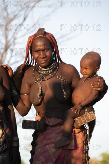 Portrait, Himba woman with baby, traditional clothing, Kaokoveld, Kunene, Namibia