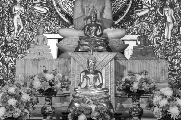 Various Buddha statues, Bhumispara mudra, Buddha Gautama at the moment of enlightenment, as well as meditating and teaching, Wat Sitthawararam, Bangkok, Thailand